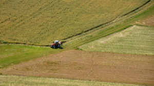 aerial shot of farmer tending to his fields