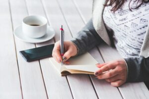 woman writing in journal