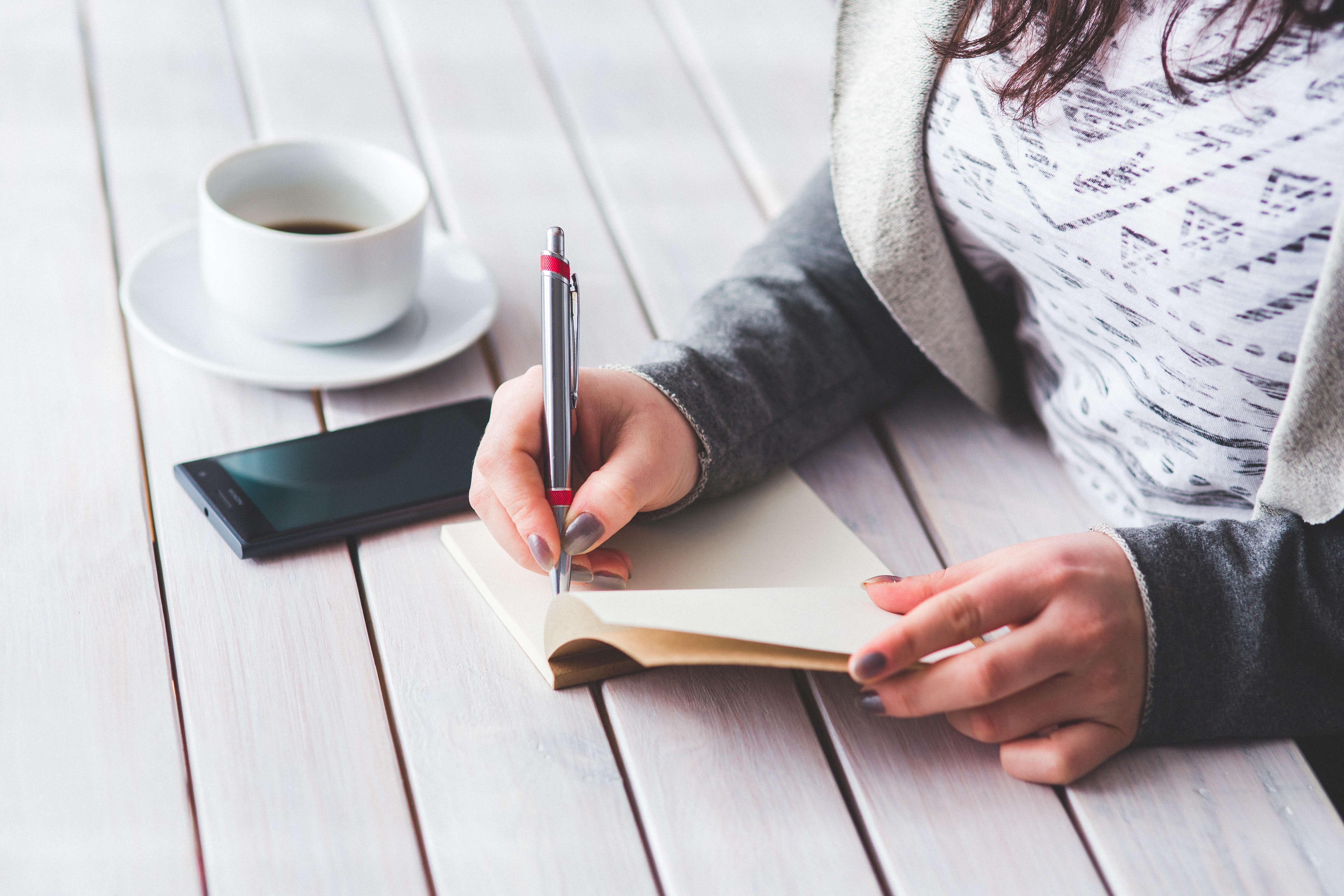 woman writing in journal